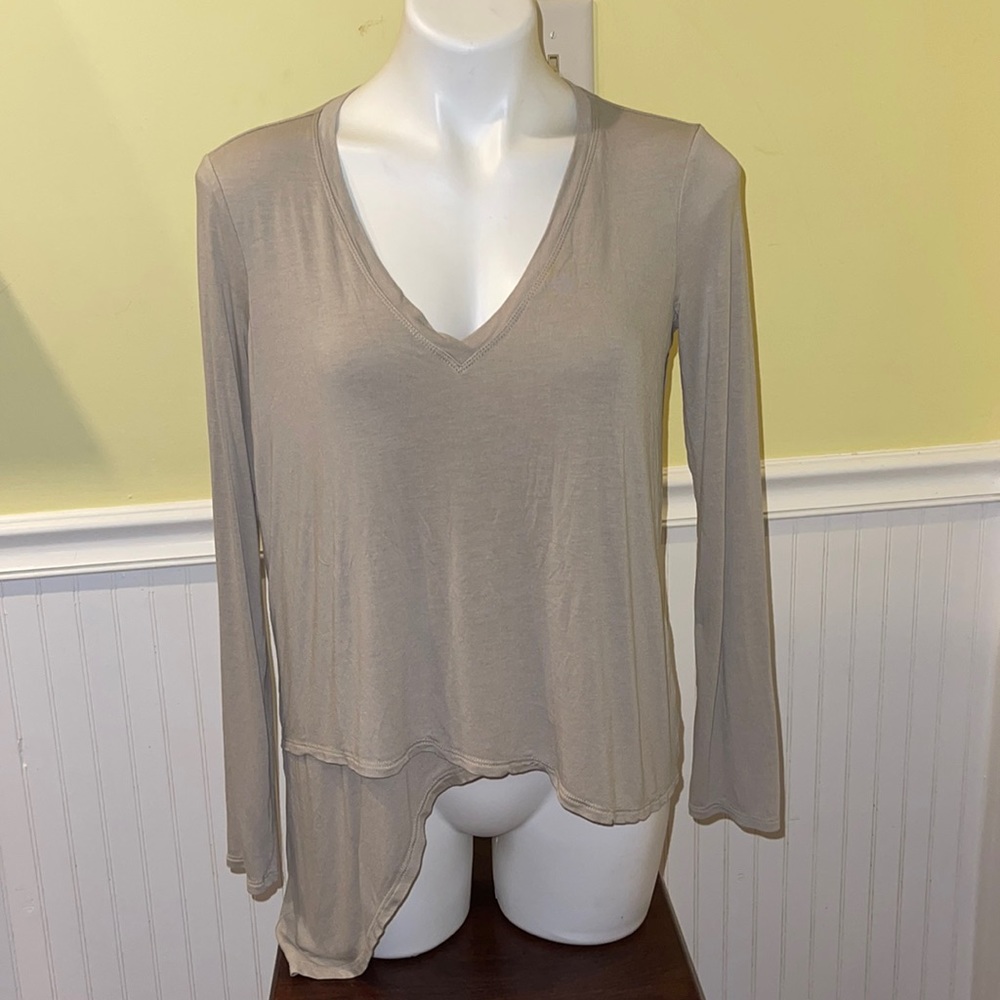 BCBGMaxazria ladies asymmetrical long sleeve top. Size small.
